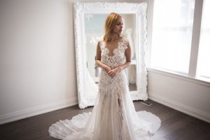 Sabrina Sgotto, 25, tries on a wedding dress called Morning, from Ines Di Santo's Fall/Winter 2016 collection at Ines Di Santo's Yorkville bridal boutique.